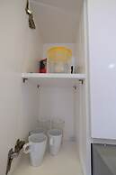 Homey and Relaxing 2BR Green Pramuka Apartment