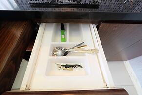 Homey and Relaxing 2BR Green Pramuka Apartment