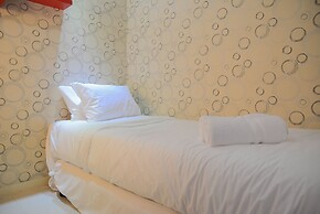 Homey and Relaxing 2BR Green Pramuka Apartment