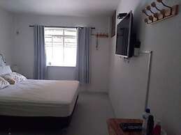 Gato de Botas Flats & Suites