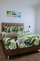 The Palm Leaf Apartments