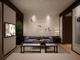 Qianna Jiuhe Boutique Hotel Zhoukou Shop