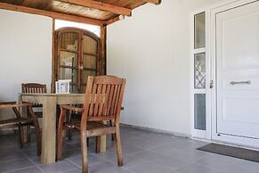 House of Paradise in front of the golf court-sea