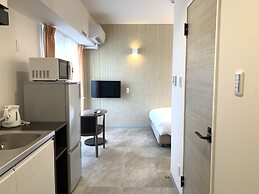 Mr.KINJO Miki24 in front of Makishi Station