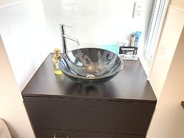 Mr.KINJO Miki24 in front of Makishi Station