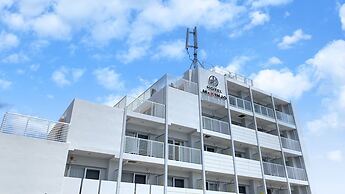 Mr.KINJO in front of Manza Beach