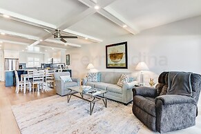 High End Coastal Feel Condo with Access to Beachside Pool by RedAwning