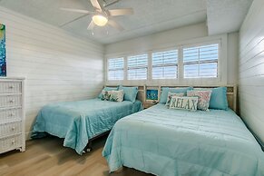 High End Coastal Feel Condo with Access to Beachside Pool by RedAwning