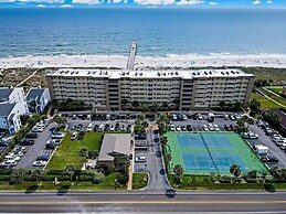 High End Coastal Feel Condo with Access to Beachside Pool by RedAwning