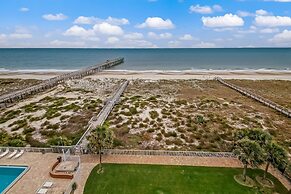 High End Coastal Feel Condo with Access to Beachside Pool by RedAwning