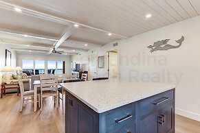 High End Coastal Feel Condo with Access to Beachside Pool by RedAwning