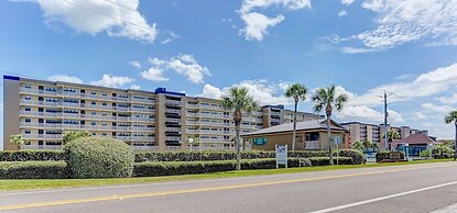 High End Coastal Feel Condo with Access to Beachside Pool by RedAwning