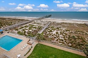 High End Coastal Feel Condo with Access to Beachside Pool by RedAwning