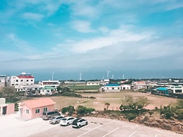 Windmill and Sea Pension