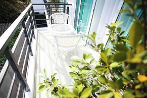 One World One Home Naiharn Hotel