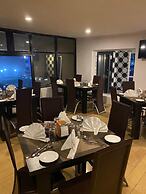 Posh Hotel And Suites