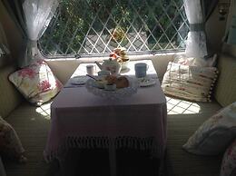 Kitty Unique 60s Caravan set in Pretty Garden