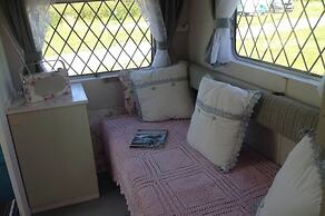 Kitty Unique 60s Caravan set in Pretty Garden