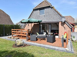 Snug Holiday Home in Herkingen with Hot Tub in Garden