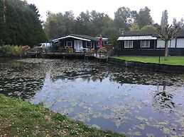 Modern Chalet in a Small Park With a Fishing Pond