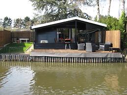 Modern Chalet in a Small Park With a Fishing Pond