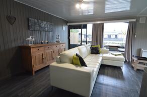 Modern Chalet in a Small Park With a Fishing Pond