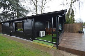 Modern Chalet in a Small Park With a Fishing Pond