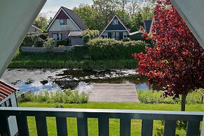 Modern Holiday Home at a Typical Dutch Canal, Close to the Lauwersmeer