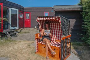 Chalet Gaby With Sauna, Private Dock, and Canoes at Lauwersmeer