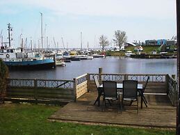 Chalet Gaby With Sauna, Private Dock, and Canoes at Lauwersmeer
