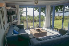8 Pers. Holiday Home in Front of the Lauwersmeer and own Fishing Pier