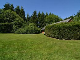 A Wooden Chalet Located in a Quiet and Green