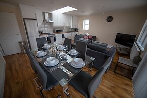 The Coach House by Riis Property