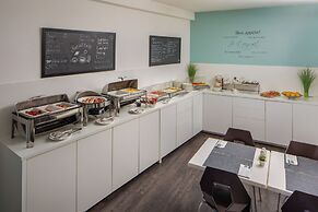 Escala Hotel & Suites