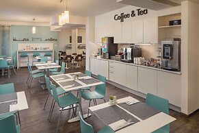 Escala Hotel & Suites