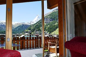 Mountain Exposure Luxury Chalets & Penthouses & Apartments