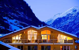 Mountain Exposure Luxury Chalets & Penthouses & Apartments