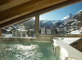 Mountain Exposure Luxury Chalets & Penthouses & Apartments