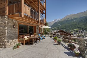 Mountain Exposure Luxury Chalets & Penthouses & Apartments