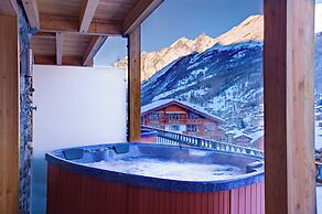 Mountain Exposure Luxury Chalets & Penthouses & Apartments