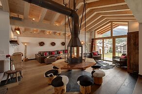 Mountain Exposure Luxury Chalets & Penthouses & Apartments