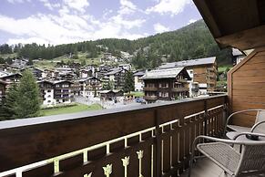 Mountain Exposure Luxury Chalets & Penthouses & Apartments