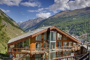 Mountain Exposure Luxury Chalets & Penthouses & Apartments
