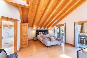 Mountain Exposure Luxury Chalets & Penthouses & Apartments