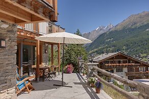 Mountain Exposure Luxury Chalets & Penthouses & Apartments