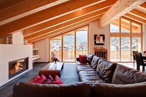 Mountain Exposure Luxury Chalets & Penthouses & Apartments