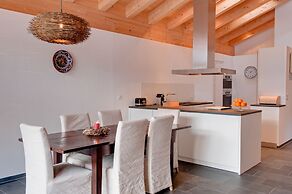 Mountain Exposure Luxury Chalets & Penthouses & Apartments
