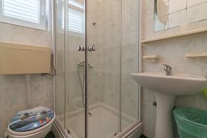 Apartment for 4 Guests Near the Beach in Biograd, Lovely Garden Modern