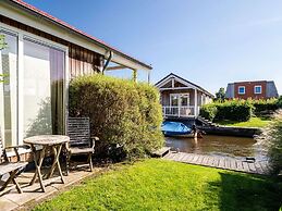Cozy Chalet Right on the Water in Friesland