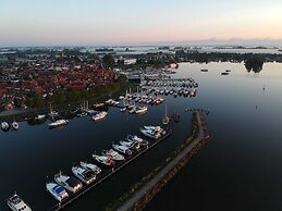 Cozy Chalet Right on the Water in Friesland
